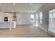 Modern kitchen with white cabinets, a large island, and stainless steel appliances at 612 Sidney Ct, Stockbridge, GA 30281