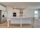 Island kitchen boasting stainless appliances, undermount sink, and neutral finishes at 612 Sidney Ct, Stockbridge, GA 30281