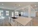 Open living space with a view of the kitchen island with stainless steel sink at 612 Sidney Ct, Stockbridge, GA 30281