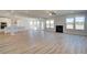 Open-concept living space with modern kitchen, fireplace, and lots of natural light at 612 Sidney Ct, Stockbridge, GA 30281