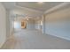 Spacious carpeted main bedroom with ceiling fan, tray ceiling, and ensuite bath with separate shower at 612 Sidney Ct, Stockbridge, GA 30281