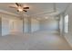 Spacious carpeted main bedroom has ceiling fan, tray ceiling, and ensuite bath and plenty of room at 612 Sidney Ct, Stockbridge, GA 30281
