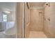 Bright bathroom featuring tiled floors, dual sinks, freestanding tub, and large tile-surround shower at 612 Sidney Ct, Stockbridge, GA 30281
