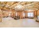 Unfinished basement showcasing insulation, a window, a couch, and stairs at 737 Heritage Post Ln, Grayson, GA 30017