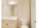 Bright bathroom featuring a white sink and toilet at 737 Heritage Post Ln, Grayson, GA 30017