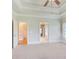 Light-filled bedroom with plush carpet, trey ceiling, and doors leading to other rooms at 737 Heritage Post Ln, Grayson, GA 30017