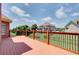 Large wooden deck with railing, offering scenic views of the backyard at 737 Heritage Post Ln, Grayson, GA 30017