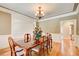 Dining room with hardwood floors, chair rail molding, and chandelier at 737 Heritage Post Ln, Grayson, GA 30017