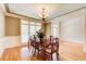 Dining room with hardwood floors, chair rail molding, and chandelier at 737 Heritage Post Ln, Grayson, GA 30017