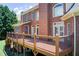 Spacious elevated deck, connected to a brick home with a walkout basement at 737 Heritage Post Ln, Grayson, GA 30017