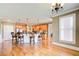 Open-concept kitchen area with hardwood floors, a bar-height island, and stainless steel appliances at 737 Heritage Post Ln, Grayson, GA 30017