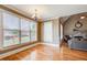 Bright living room with hardwood floors, large windows, and view of the outdoor deck at 737 Heritage Post Ln, Grayson, GA 30017