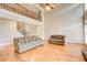 Open concept living room with a vaulted ceiling, hardwood floors, and staircase at 737 Heritage Post Ln, Grayson, GA 30017