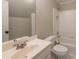 Clean bathroom with a vanity, toilet, and shower-tub combination at 772 Vinings Estates Se Dr, Mableton, GA 30126