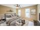 Cozy bedroom features a large bed, side tables, two windows and neutral paint at 772 Vinings Estates Se Dr, Mableton, GA 30126