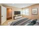 Comfortable bedroom with natural light, television and neutral walls at 772 Vinings Estates Se Dr, Mableton, GA 30126