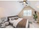 Bright bedroom featuring a ceiling fan, window, and neutral decor at 772 Vinings Estates Se Dr, Mableton, GA 30126