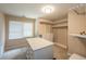 Walk in closet has built in shelves, drawers and a large window for natural light at 772 Vinings Estates Se Dr, Mableton, GA 30126
