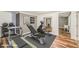 Home gym equipped with treadmill, weight bench, and exercise equipment at 772 Vinings Estates Se Dr, Mableton, GA 30126