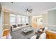 Comfortable living room with hardwood floors, neutral tones, and natural light at 772 Vinings Estates Se Dr, Mableton, GA 30126