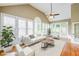 Bright living room features a large picture window, comfortable seating and hardwood floors at 772 Vinings Estates Se Dr, Mableton, GA 30126