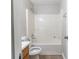 Modest bathroom featuring a shower and tub combo and a partially visible toilet and vanity at 340 Onyx Ct, Atlanta, GA 30349