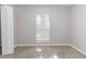 Bright empty bedroom with a window letting in light and a neutral carpet at 340 Onyx Ct, Atlanta, GA 30349