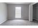 Bare bedroom with light coming through the window and an open closet for easy storage at 340 Onyx Ct, Atlanta, GA 30349
