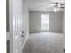 Neutrally painted bedroom with carpet, a ceiling fan and a window at 340 Onyx Ct, Atlanta, GA 30349