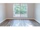 Inviting bedroom with a large window, wood floors, and ample natural light at 340 Onyx Ct, Atlanta, GA 30349