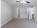 Spacious bedroom featuring neutral walls and carpet, ceiling fan, and access to closet and fireplace at 340 Onyx Ct, Atlanta, GA 30349