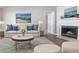 Comfortable living room featuring stylish decor, a modern fireplace, and lots of natural light at 340 Onyx Ct, Atlanta, GA 30349