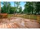 Picture of the new wooden back deck overlooking the lush green backyard, perfect for outdoor entertaining and relaxation at 3664 Nessa Se Ct, Smyrna, GA 30082
