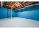 This unfinished basement features blue cinderblock walls and an exposed ceiling at 3664 Nessa Se Ct, Smyrna, GA 30082