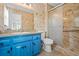 Updated bathroom with tile floors, vanity with sink, and glass shower enclosure at 3664 Nessa Se Ct, Smyrna, GA 30082