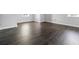 Bedroom with hardwood flooring, white base trim, and light gray walls at 3664 Nessa Se Ct, Smyrna, GA 30082