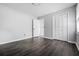 This bedroom features wood-look flooring, neutral walls, and a closet for ample storage space at 3664 Nessa Se Ct, Smyrna, GA 30082