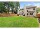 Large backyard with expansive lawn, patio and wooden fence at 4018 Rhyne Se Cir, Smyrna, GA 30082
