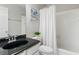 Bathroom featuring single sink vanity, toilet, and tub with shower at 4018 Rhyne Se Cir, Smyrna, GA 30082