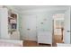 Light green bedroom showcasing twin beds, a closet and an open doorway at 4018 Rhyne Se Cir, Smyrna, GA 30082