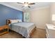 Bedroom featuring blue accent wall, wood furniture and window at 4018 Rhyne Se Cir, Smyrna, GA 30082