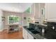 Bright kitchen features granite counters, stainless faucet, and island with breakfast bar at 4018 Rhyne Se Cir, Smyrna, GA 30082