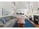 Spacious living room with fireplace, hardwood floors, and open kitchen and loft area at 4018 Rhyne Se Cir, Smyrna, GA 30082