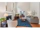 Bright living room features a fireplace, hardwood floors, and an open office space at 4018 Rhyne Se Cir, Smyrna, GA 30082