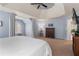 Spacious main bedroom showcasing tray ceiling, chair, and neutral carpet at 4018 Rhyne Se Cir, Smyrna, GA 30082