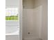 Bright bathroom features a large soaking tub and walk-in shower at 5480 Walnut Ln, Lithonia, GA 30038