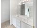 Bathroom features a double sink vanity, large mirror, and bright lighting at 5480 Walnut Ln, Lithonia, GA 30038