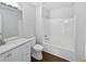 Spotless bathroom featuring an updated vanity and shower-tub combo at 5480 Walnut Ln, Lithonia, GA 30038