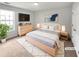 Bright bedroom featuring a plush rug and modern decor at 5480 Walnut Ln, Lithonia, GA 30038