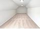 This carpeted bonus room features recessed lighting and is freshly painted at 5480 Walnut Ln, Lithonia, GA 30038